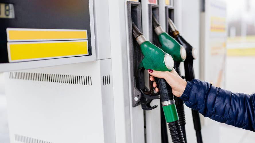 1571645388067-woman-holding-fuel-nozzle-at-petrol-station